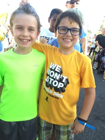 (Above) Many old and new friends are seen at the walk, and Zane, age 9, hangs out with a good friend at the event in 2016. All photos courtesy of Mrs. Maranda Arnold. 
