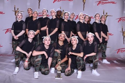 (Above) As I was apprehensive to start training in hip-hop, my studio and
team (shown above), helped me build up the courage to learn skills, as well
as perform on stage. The support that my studio shows while being onstage
is huge, with loud cheering and yelling. Also, other studios chime in with
this same encouragement, making dancing on stage and competing less nerve
wracking. After the first competition, I never doubted my ability in hip-hop,
and I continue to perform multiple pieces in that style. Photo courtesy of

Tremaine Dance.