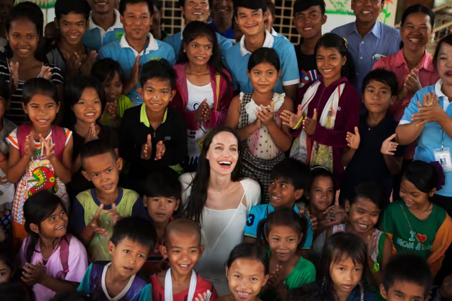 (Above: Angelina Jolie (center) visits one of her chari-
ties, the Maddox Chivan Children’s Center, in Cambodia.

The organization was founded in 2006 and helps children
affected by HIV/AIDS in multiple ways. It is named after

her son, Maddox Jolie-Pitt, who she adopted from Cambo-
dia. Photo courtesy of Getty Images.