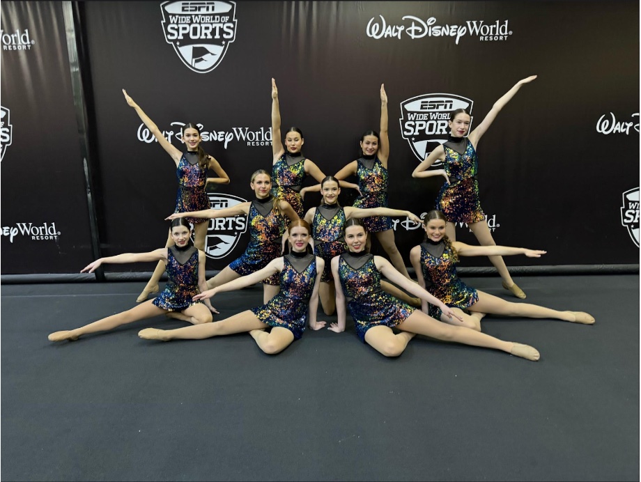%28Above%29+LHP%E2%80%99s+Junior+Varsity+team+poses+for+a+pre-performance+photo+at+Disney%E2%80%99s+Wide+World+of+Sports.+Haley+Fazekas%2C+the+captain+of+the+team%2C+is+in+the+center.+The+team+is+about+to+compete+in+the+Junior+section+of+the+competition%2C+and+they+have+been+practicing+their+routine+for+several+months.+Last+year%2C+their+dance+was+choreographed+by+professional+choreographers+in+a+five-hour+rehearsal+over+Thanksgiving+break.+This+year%2C+they+practiced+for+their+competition+at+the+Studio+Synergy.+A+panel+of+judges+will+score+them+based+on+various+criteria+such+as+technique%2C+choreography%2C+and+costumes.+With+this+level+of+rehearsal%2C+the+final+product+was+outstanding.