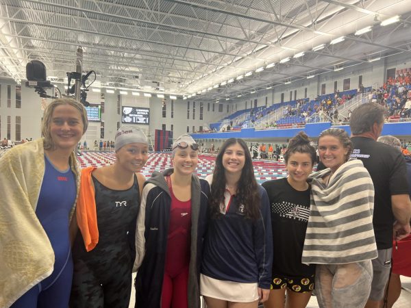 (Above) The many athletes like to take photos after each event for memories and to help calm them down before they know the final results. The swimmers had great scores in States with relay, breaststroke, and freestyle. 