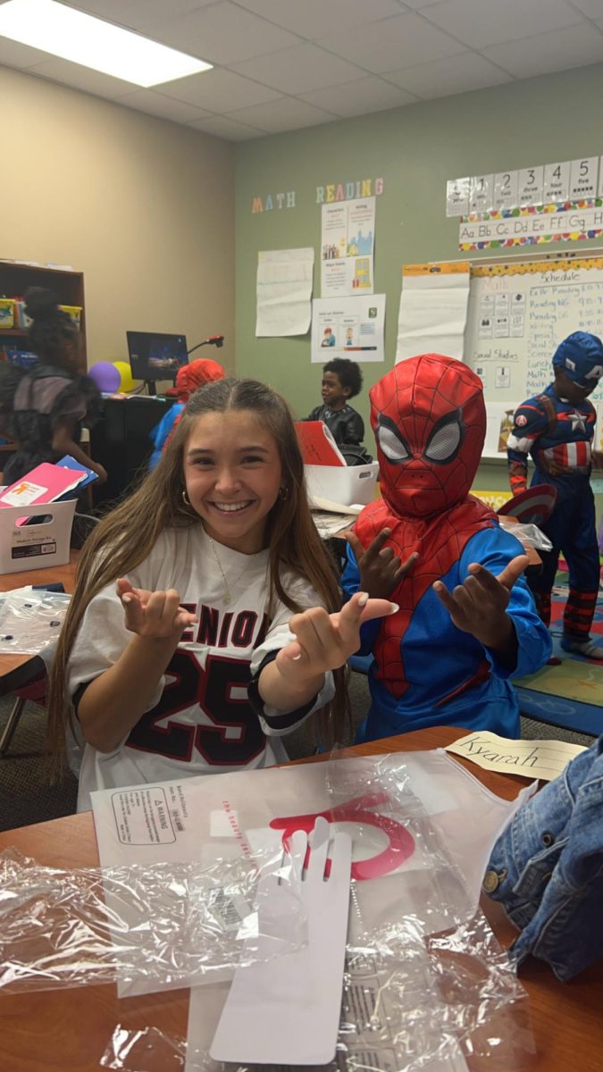 (Above) Seniors, such as Ayla Moffitt, who took Intro to Leadership often decided to K.I.L.T. during the year that follows. This allows students to share their love of volunteering with others. 