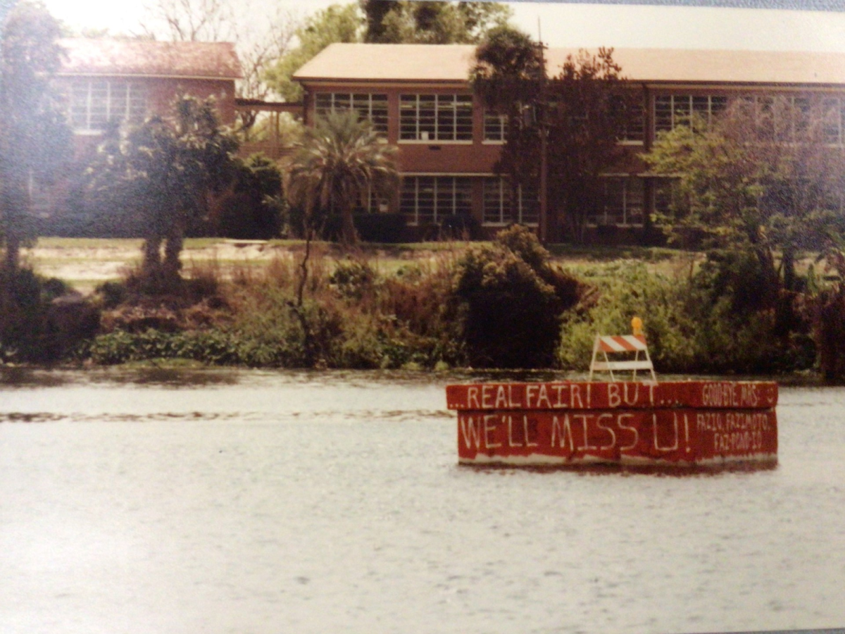 (Above) Many years ago, Seniors would canoe on the weekends to "The Block" and graffiti creative messages. 