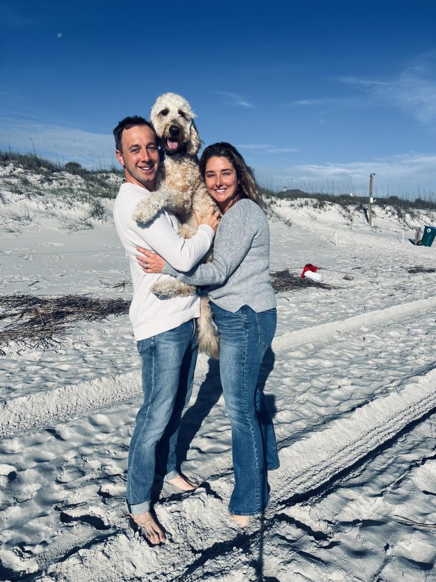 (Above)  Mr. and Mrs. Thomas have adopted Ollie into the family. Ollie has become one of their favorite travel buddies, taking him on most family vacations, especially at the beach. Ollie loves to spend time with his family and loves to play on the sandy shores of Neptune Beach.