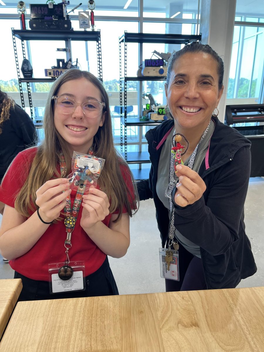 (Above) Ms. Angie Wohltman, Wellness and Yoga Teacher, and Rachel McKenzie, grade 9, enjoy making "Worry Dolls." 