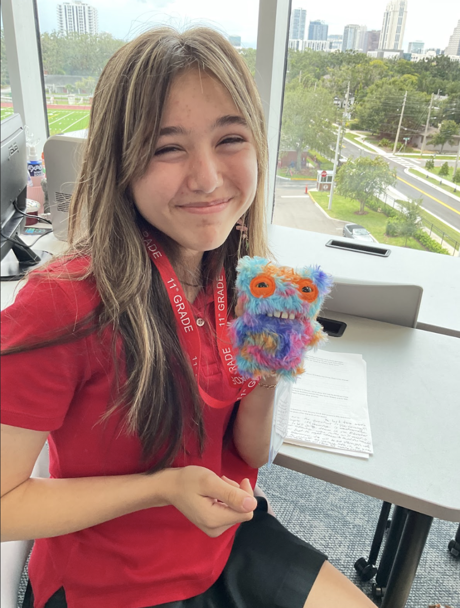 (Above) Ava Moscovitz, grade 11, shows her Fuggler. She states that she,“Prefers Fugglers as they are a lot easier to find and are more underground than Labubus are. She is holding up her toy at in her Project Magic class.
