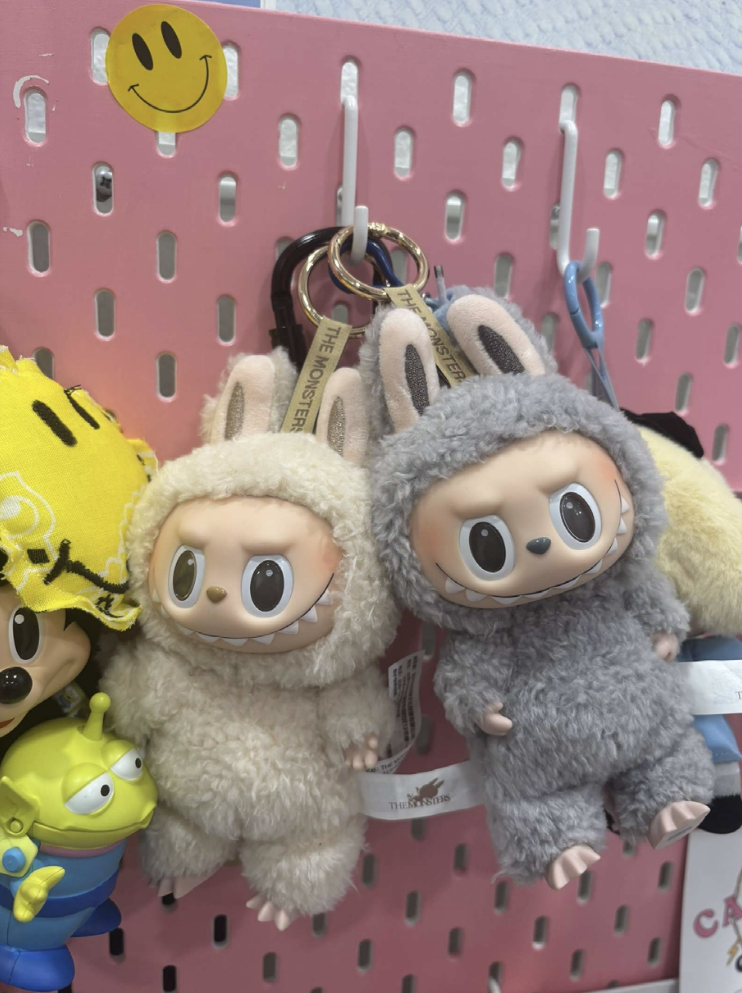 (Above) Keychains are getting heavier as Labubus are weighing them down with their big plastic faces and fuzzy bodies.
