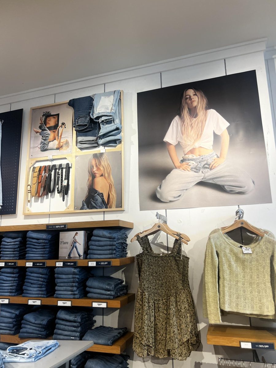 (Above) Sydney Sweeney wears her American Eagle apparel that is sold in The Florida Mall. Shoppers surrounded the area, sorting through the different pairs of jeans. Her photo shoot and famous advertisement were on posters all over the walls and entrance of the store. The scandalous photos were out for all ages to see. This blonde hair, blue eyed, all American figure now represents the fundamental imagine American Eagle wants for their brand.