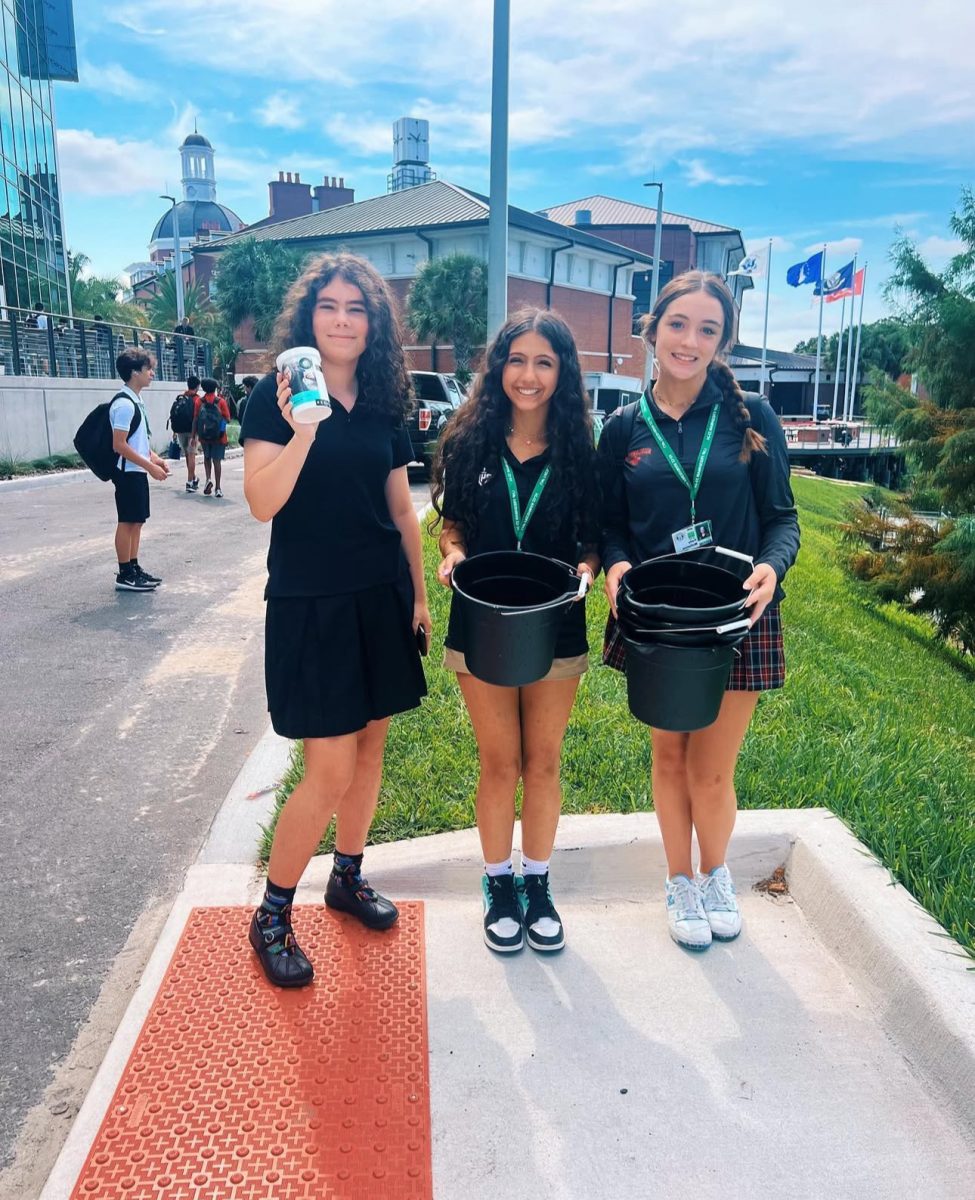 (Above) Victoria Huber, Leila Raden, and Kady Mckenna, all grade 11, are officers of the Environmental Impact Club. They began their participation in the EarthEco Water Challenge. This challenge uses tests to see if the aquatic life was thriving through ph, temperature, turbity, and oxygen level present in the water.