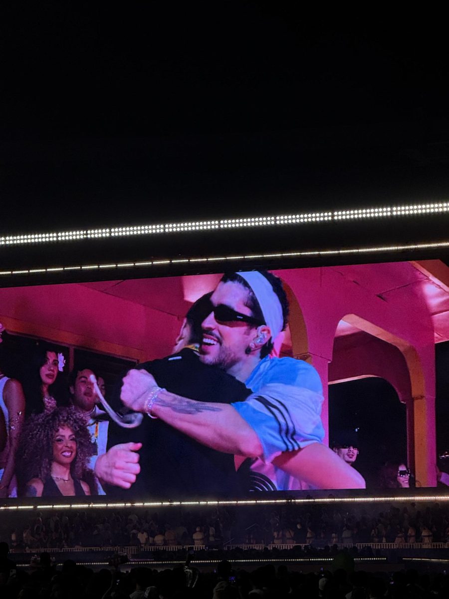 (Above) Most nights, Bad Bunny will choose a fan from the crowd to bring on stage and into “La Casita” section of his set. In this case, a fan was pulled on stage to sing the beginning of the song “VOY A LLeVarte PA PR,” which has become typical on the tour. This colorful part of the stage serves to represent what a typical, Puerto Rican home looks like and further play into his goal of honoring and keeping alive Puerto Rican culture and heritage.